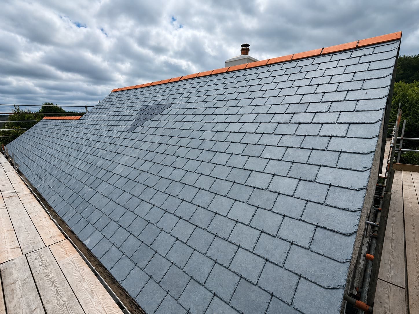 Freshly laid natural slate roof on a re-roofed Cornish property by NL Roofing